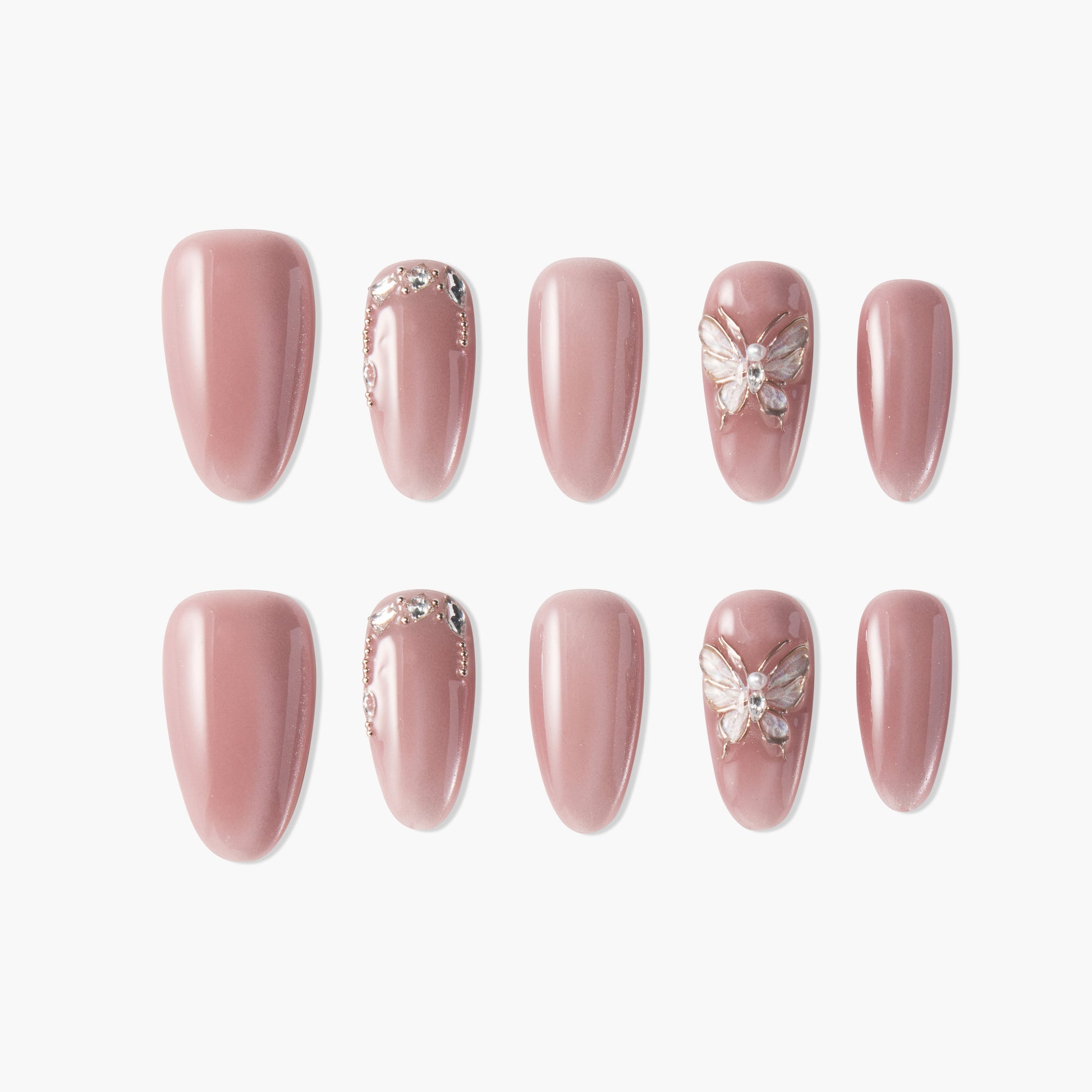 Glossy pink press-on nails with rhinestone and butterfly 3D accents, elegant nail art set