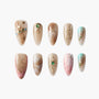 Handmade press-on nails with marble, gold accents, rhinestones, and pastel ombre designs.