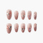Handmade pink ombre press-on nails with butterfly, rhinestone, and floral 3D designs