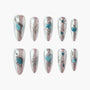 Metallic silver press-on nails with blue gemstone and heart accents, ten-piece set