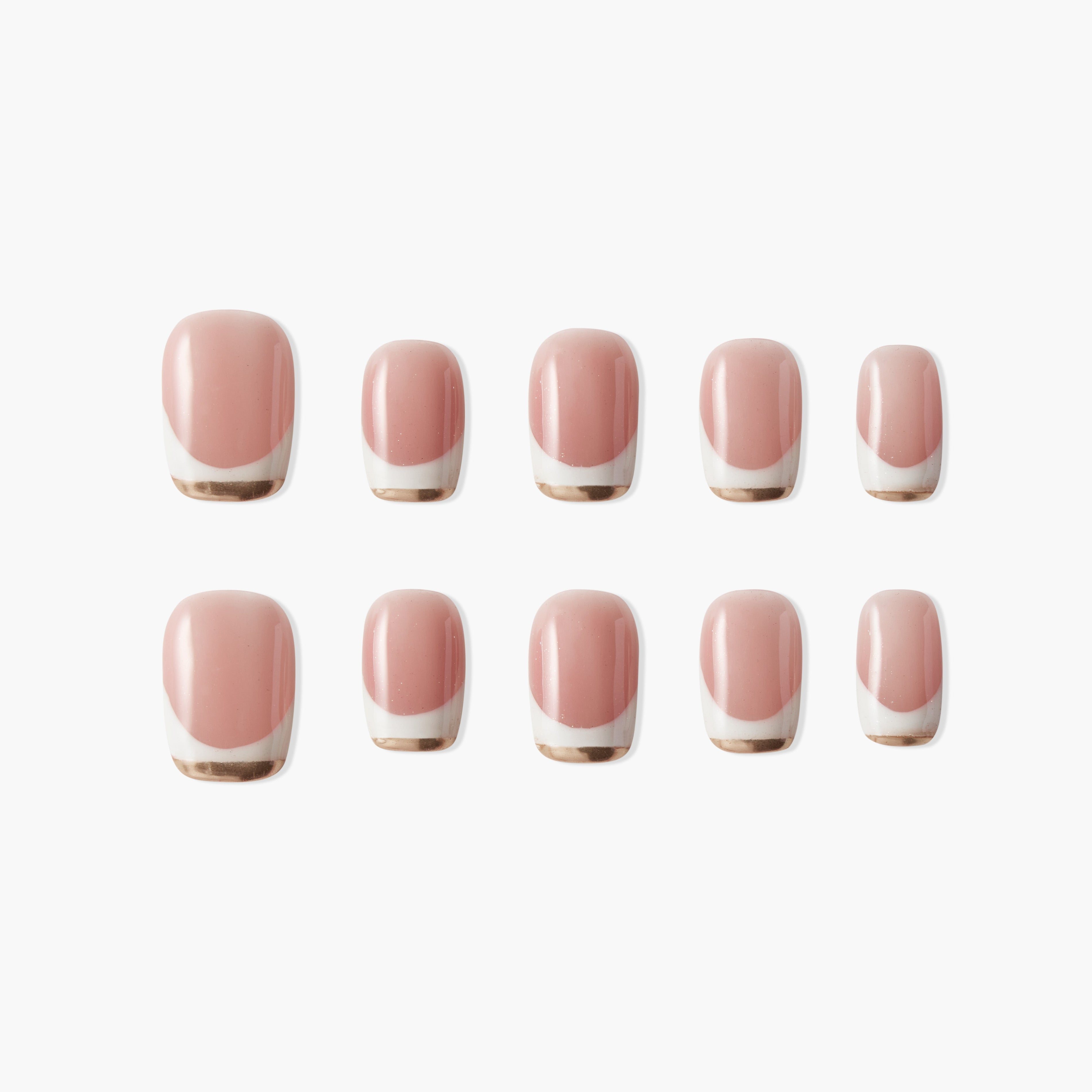 Set of pink press-on nails with gold and white French tip design on white background