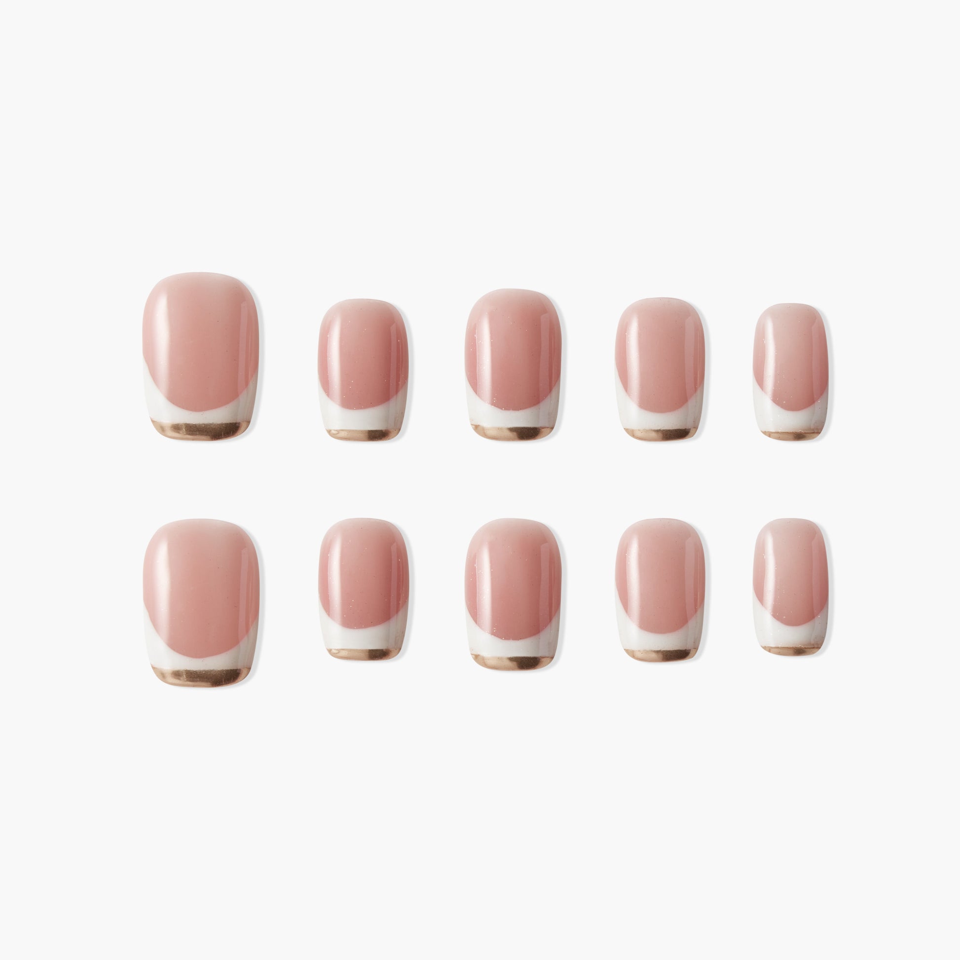 Set of pink press-on nails with gold and white French tip design on white background