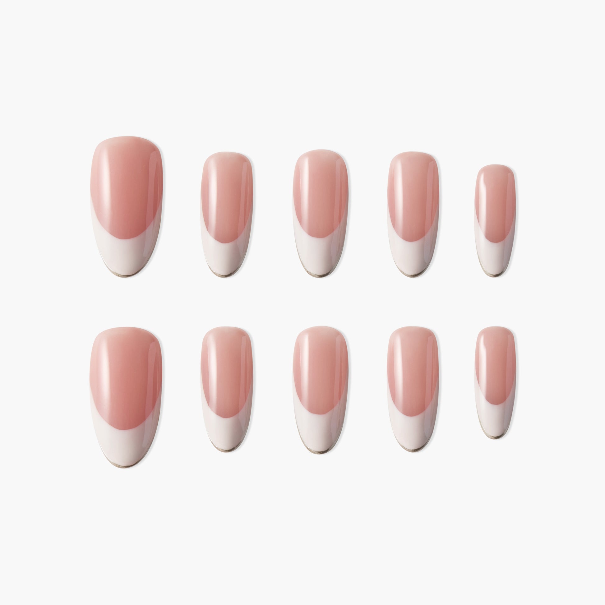 Set of pink and white French tip press-on nails, arranged on a white background.