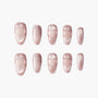 Pink shimmer press-on nails with embossed heart designs, arranged on a white background.