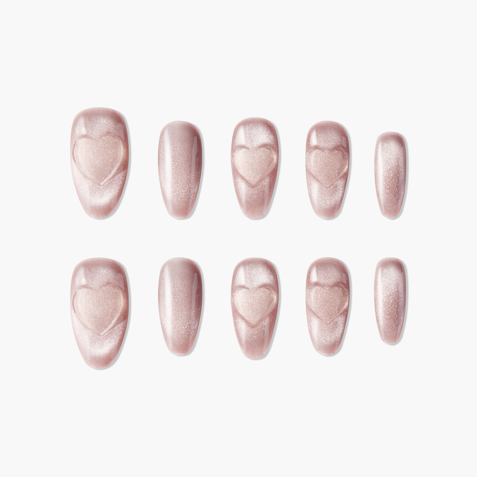 Pink shimmer press-on nails with embossed heart designs, arranged on a white background.