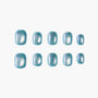 Set of blue glitter press-on nails with a glossy, iridescent finish on white background