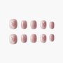 Set of square pink press-on nails with subtle shimmer and marble pattern on white background