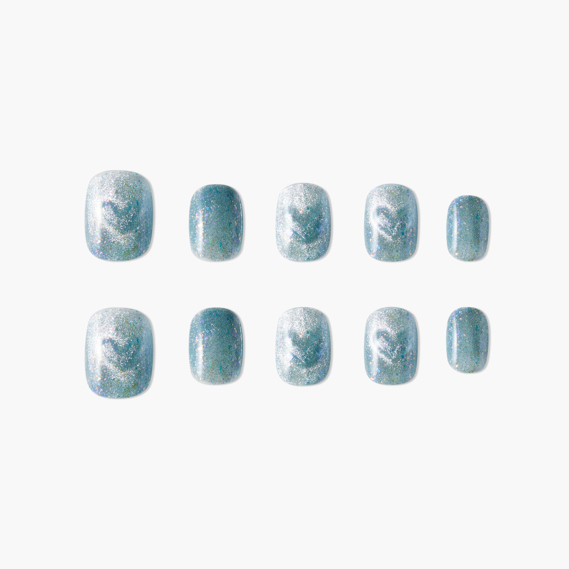 Set of blue iridescent press-on nails with glitter on a white background.