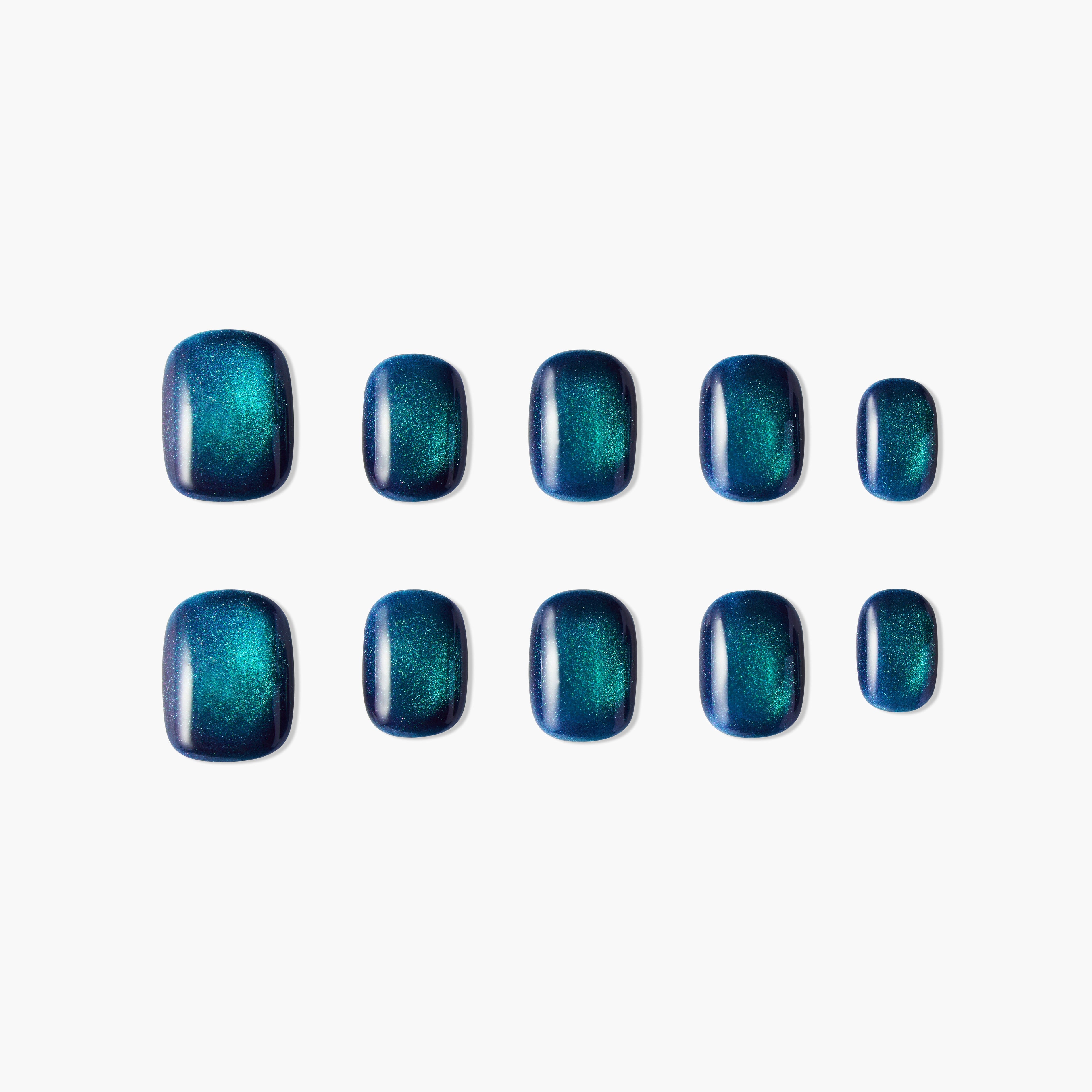 Set of glossy teal and navy ombre press-on nails with a shimmery finish on white background