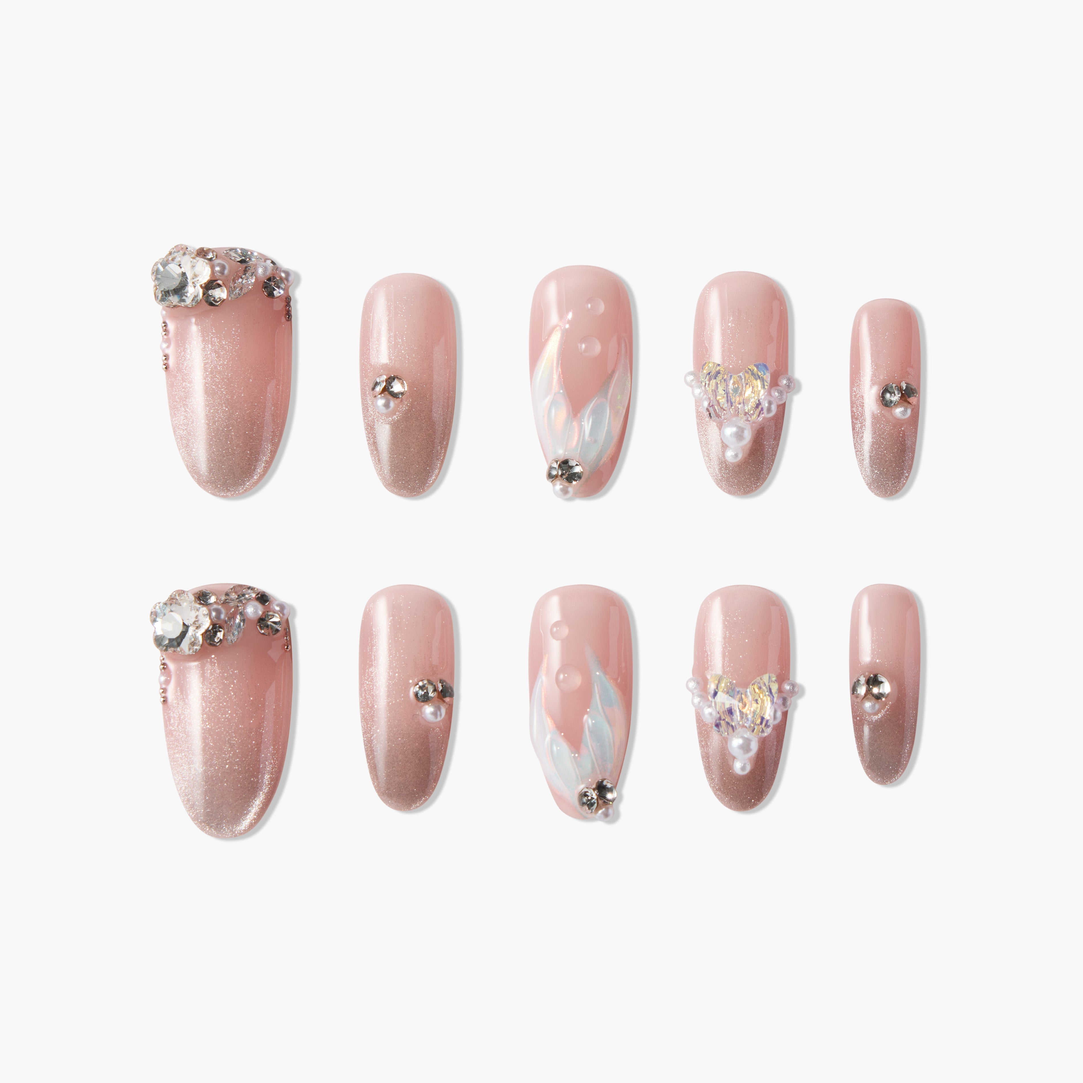 Pink ombre press-on nails with rhinestone, pearl, and iridescent 3D accents, elegant nail art set.
