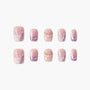 Handmade press-on nails in pink and purple with 3D pearl accents and floral designs