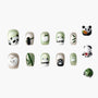 Handmade press-on nails with cute panda, paw print, and bamboo designs in green and white.