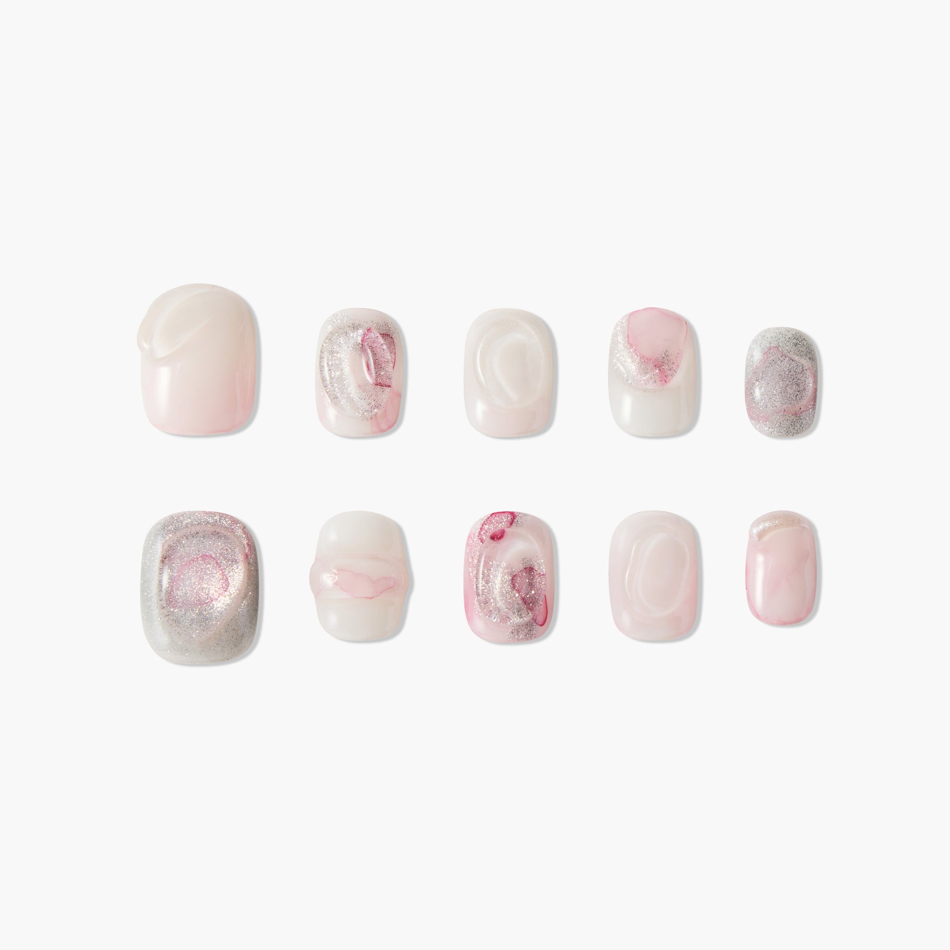 Handmade press-on nails in pink, white, and silver marble design with glossy finish