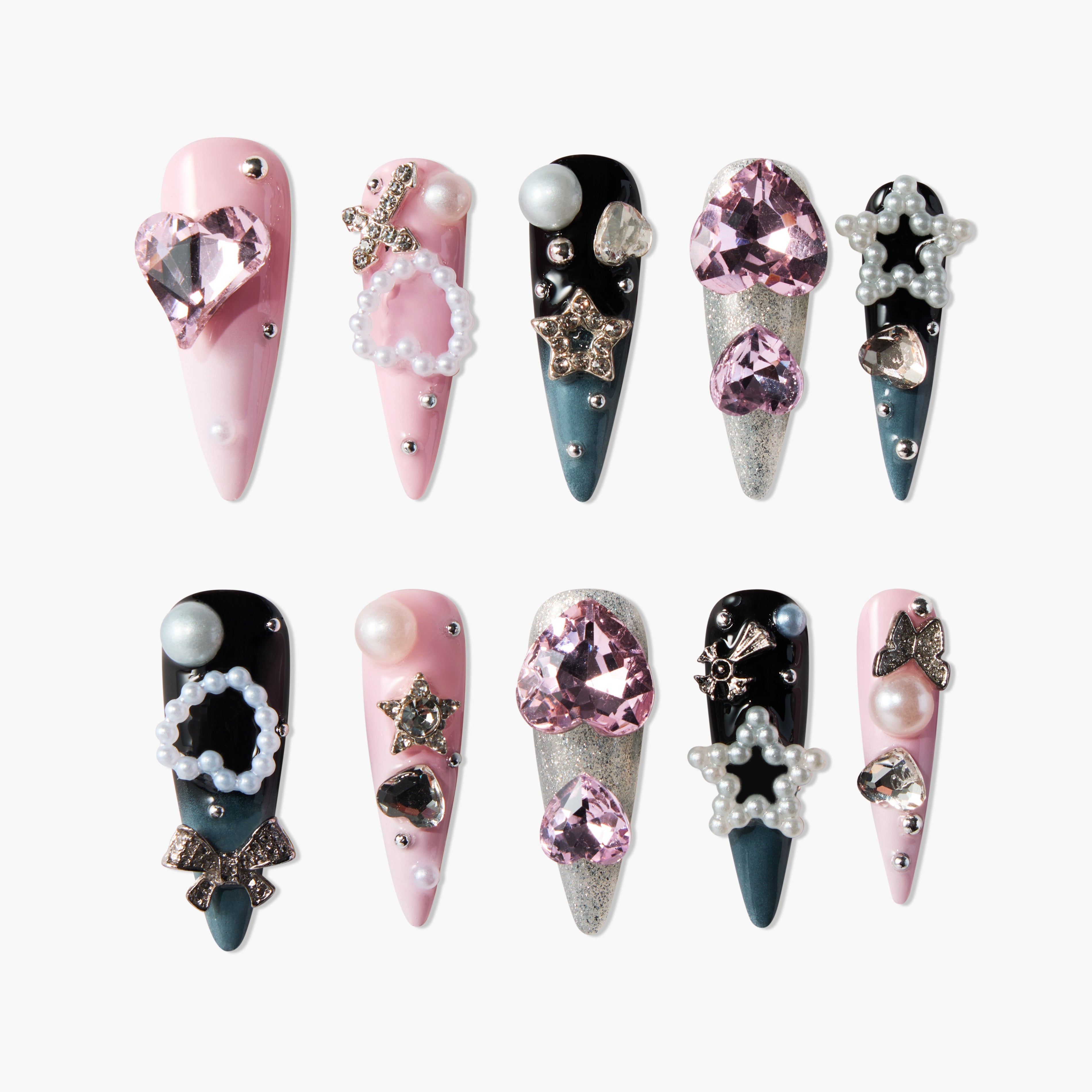 Handmade press-on nails with pink, black, and glitter designs, adorned with gems and pearls