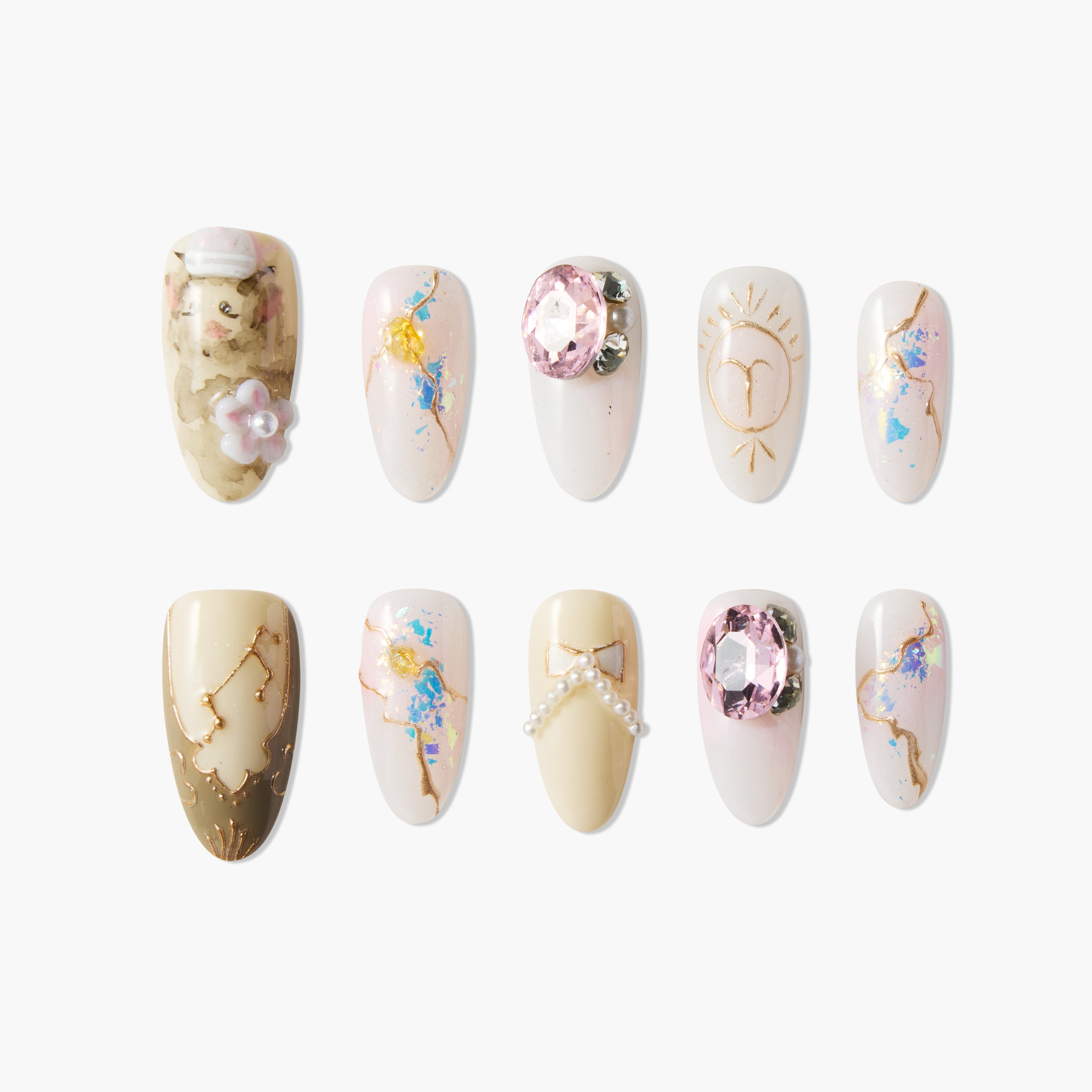 Handmade press-on nails with pink gems, gold accents, floral and pearl decorations, and abstract art.