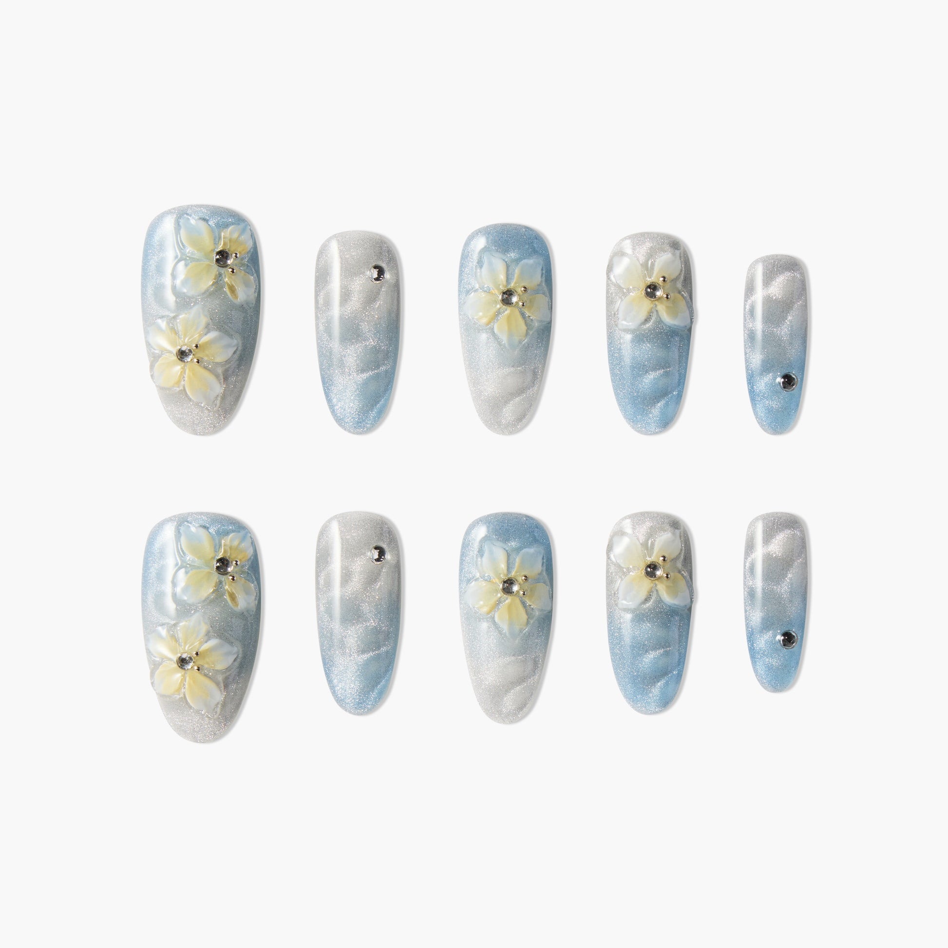 Blue and silver press-on nails with 3D yellow flowers and rhinestone accents, glossy finish