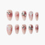 Pink ombre press-on nails with glitter, 3D jellyfish, rhinestones, and metallic accents