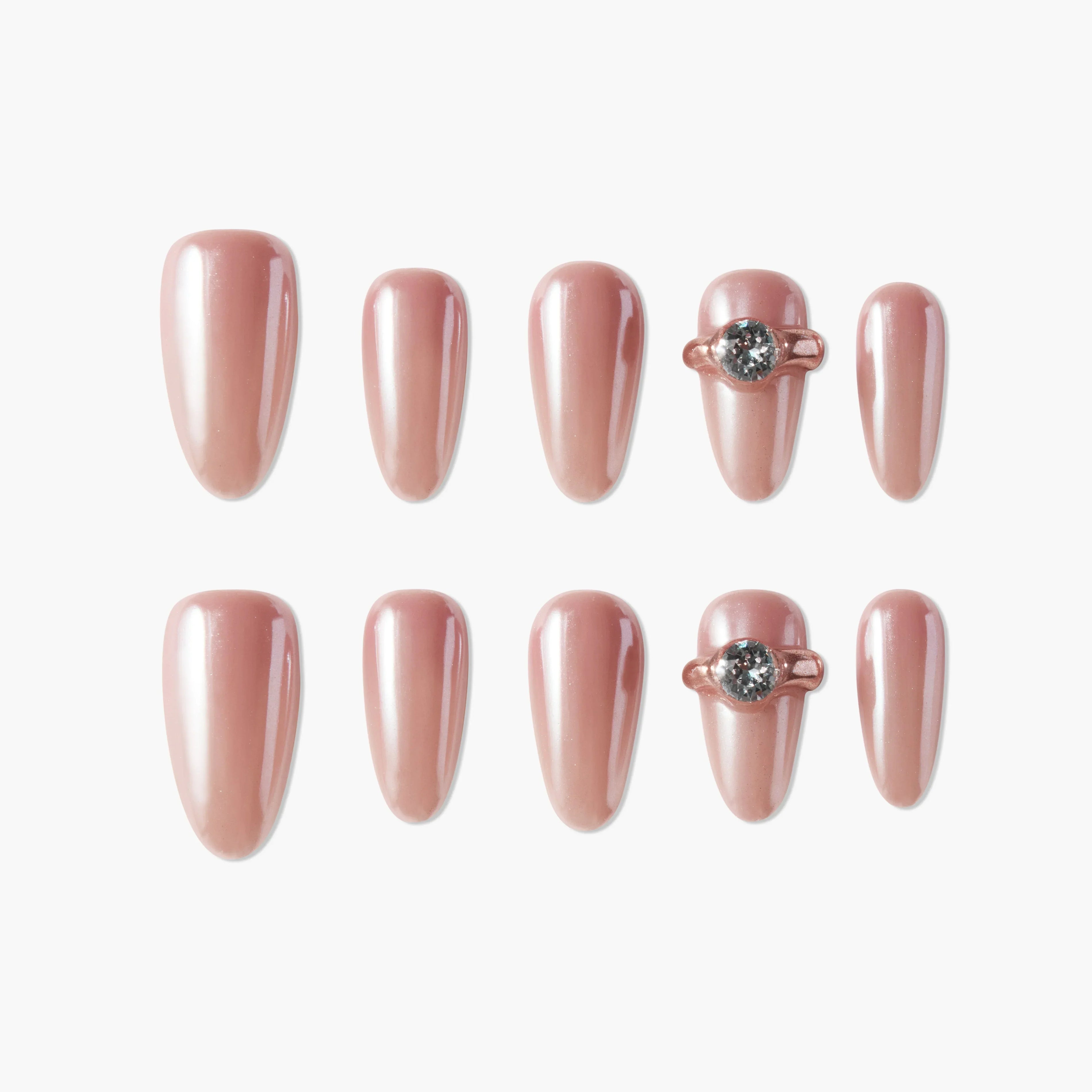 Set of glossy rose gold press-on nails with two accent nails featuring 3D gem details