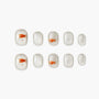 Handmade press-on nails with silver shimmer and cute orange goldfish design