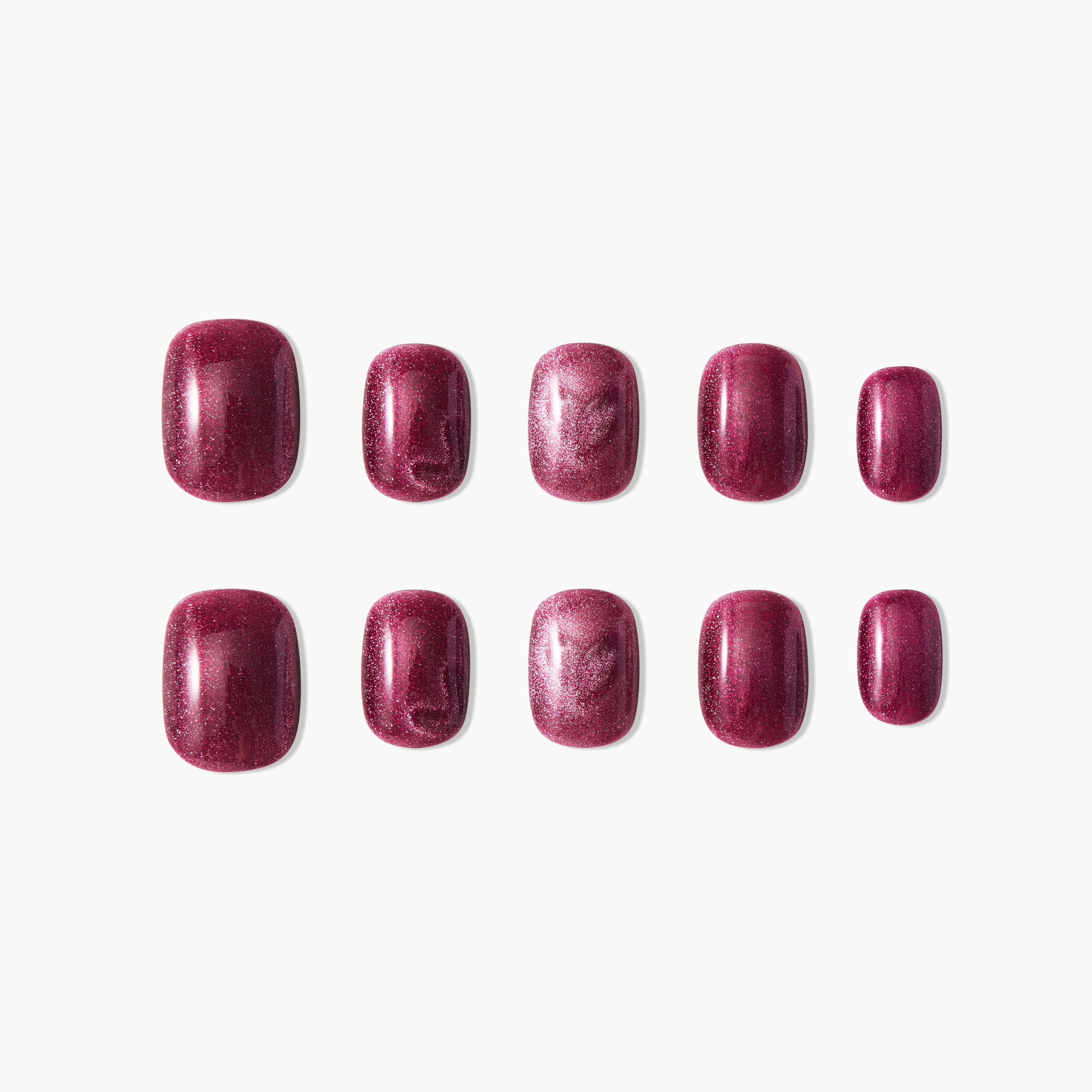 Set of glossy burgundy press-on nails with shimmer effect on a white background
