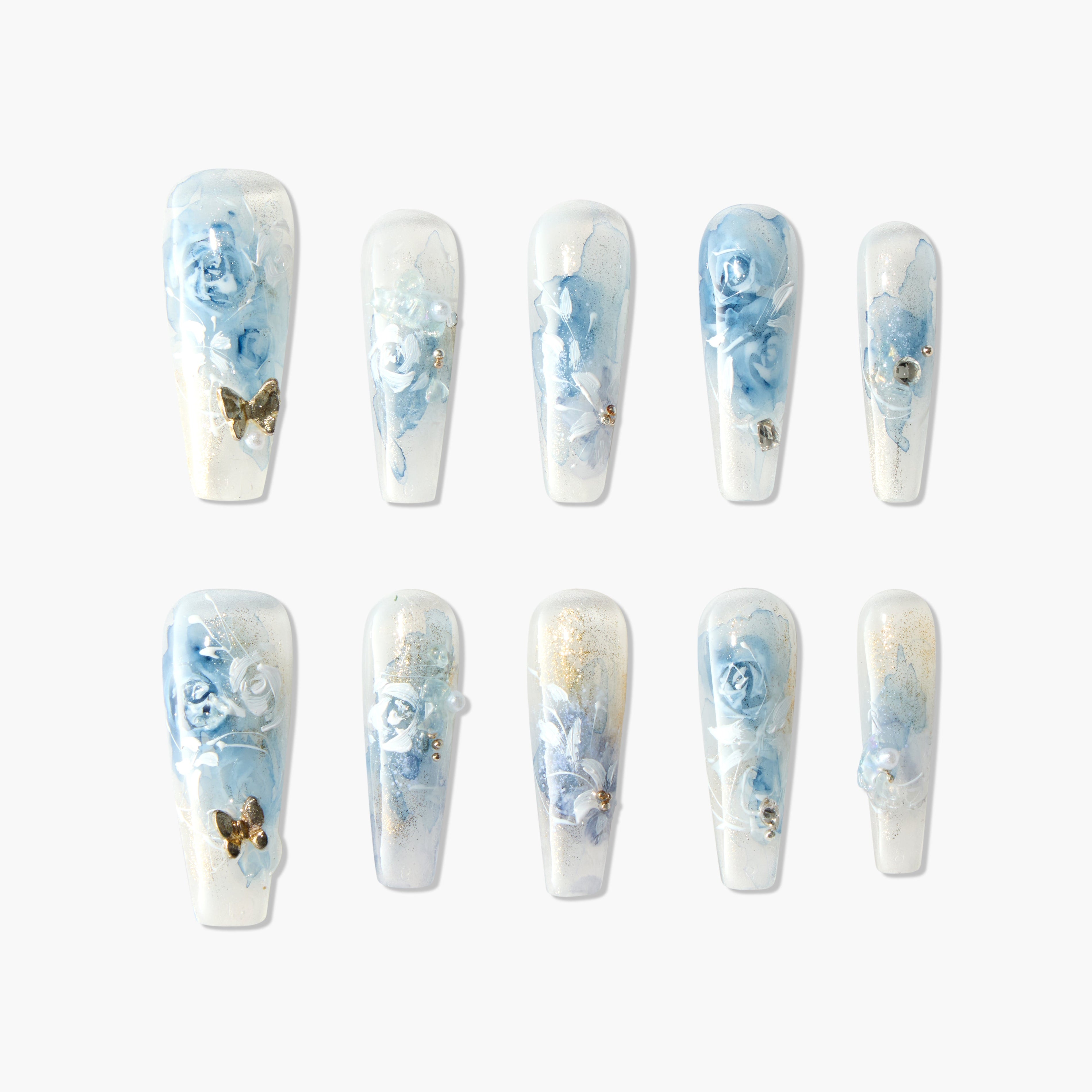Handmade press-on nails with blue rose floral design, gold accents, and pearls
