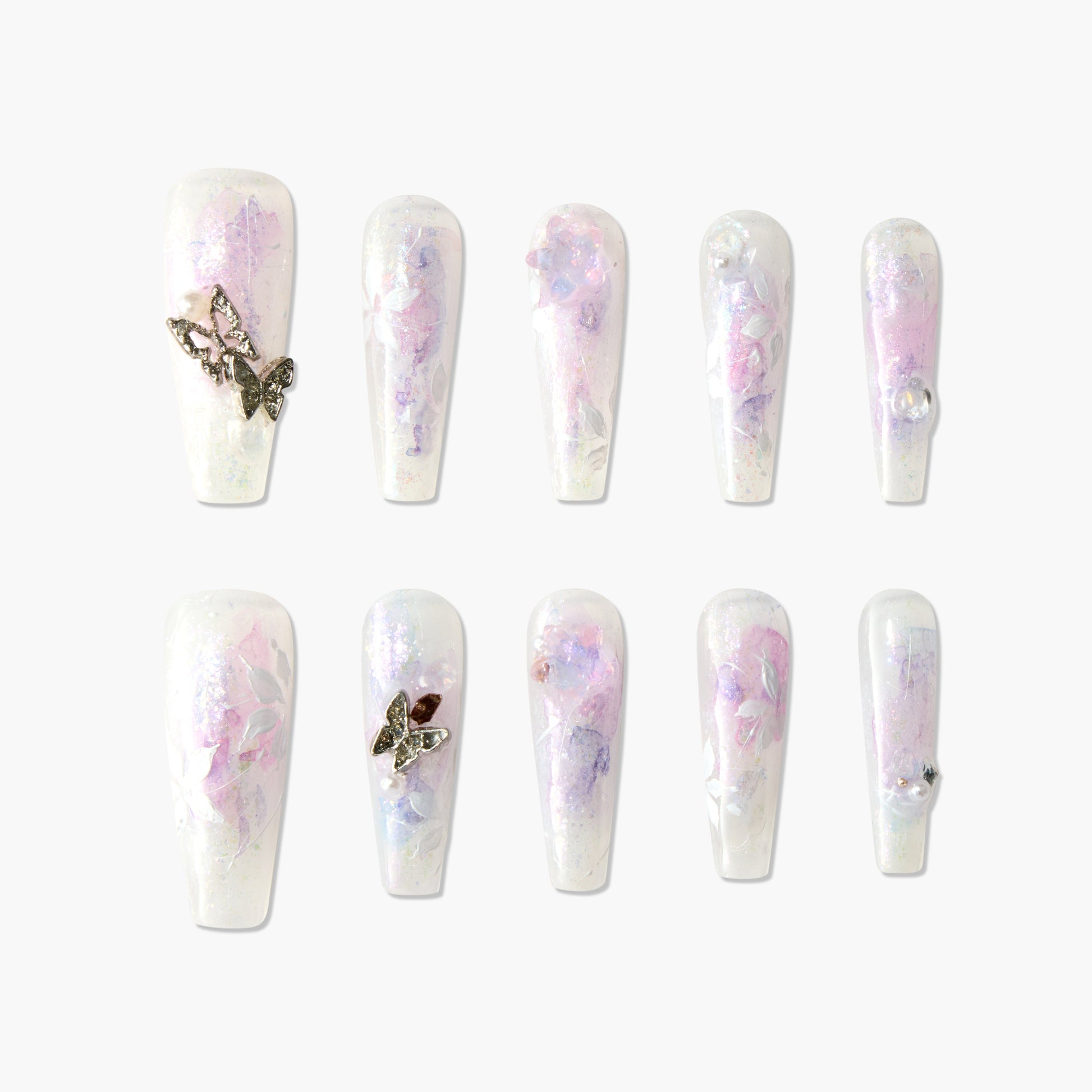 Handmade press-on nails with pastel floral designs, butterfly charms, and pearl accents