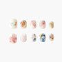 Handmade beach-themed press-on nails with seashell, starfish, and pearl accents, pastel colors
