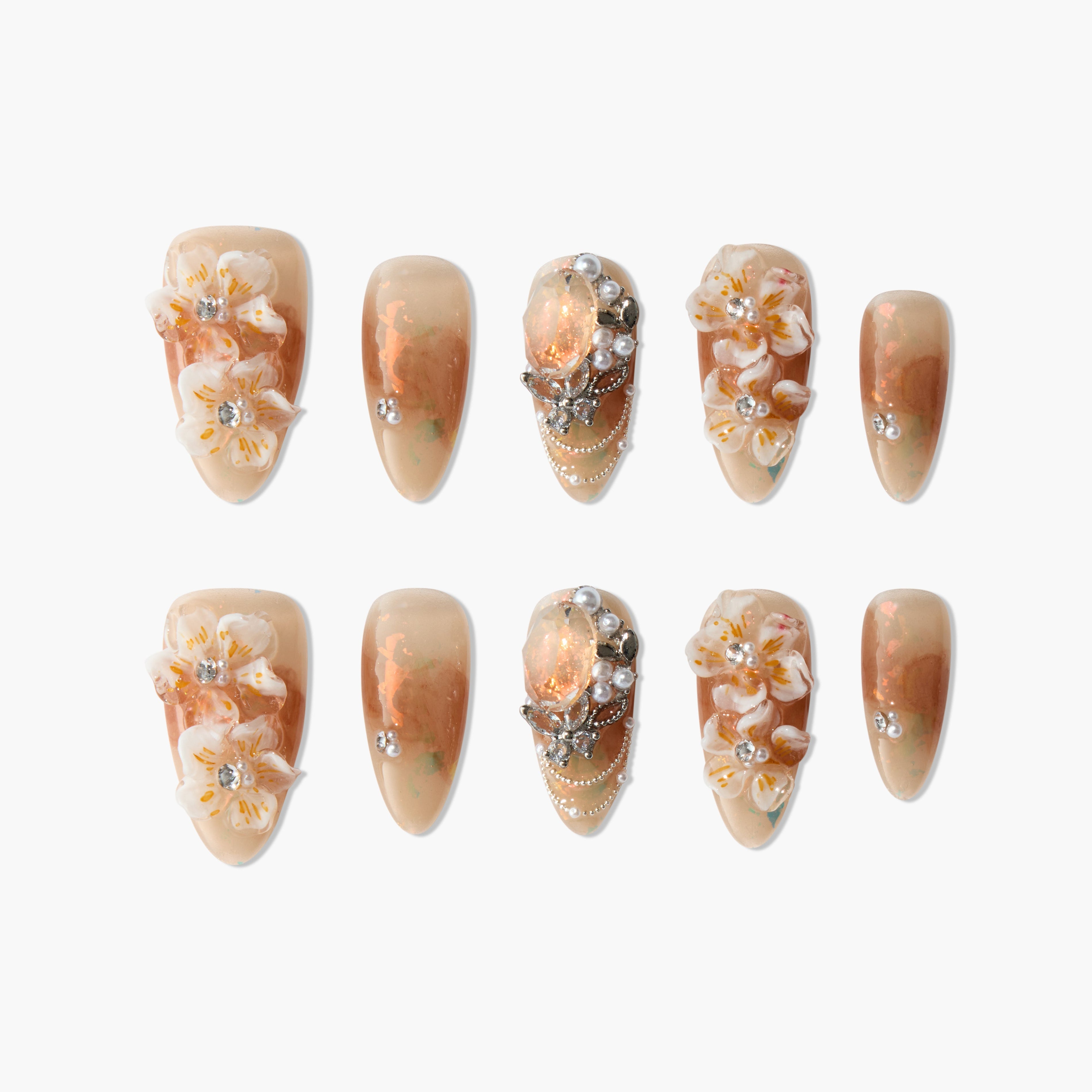Handmade press-on nails with peach marble, floral 3D accents, rhinestones, and pearl details