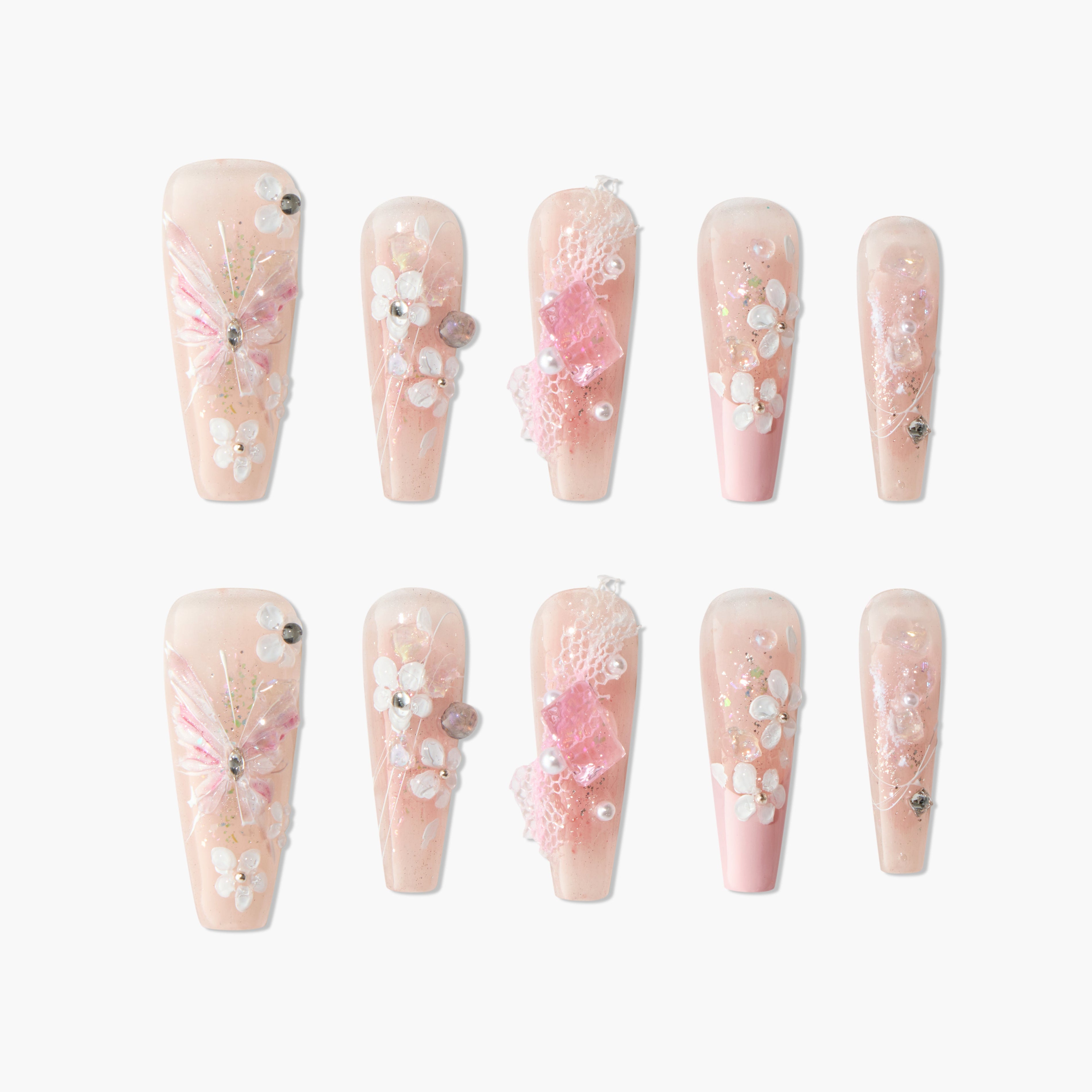 Handmade pink press-on nails with 3D floral designs, butterfly art, gems, and glitter accents.