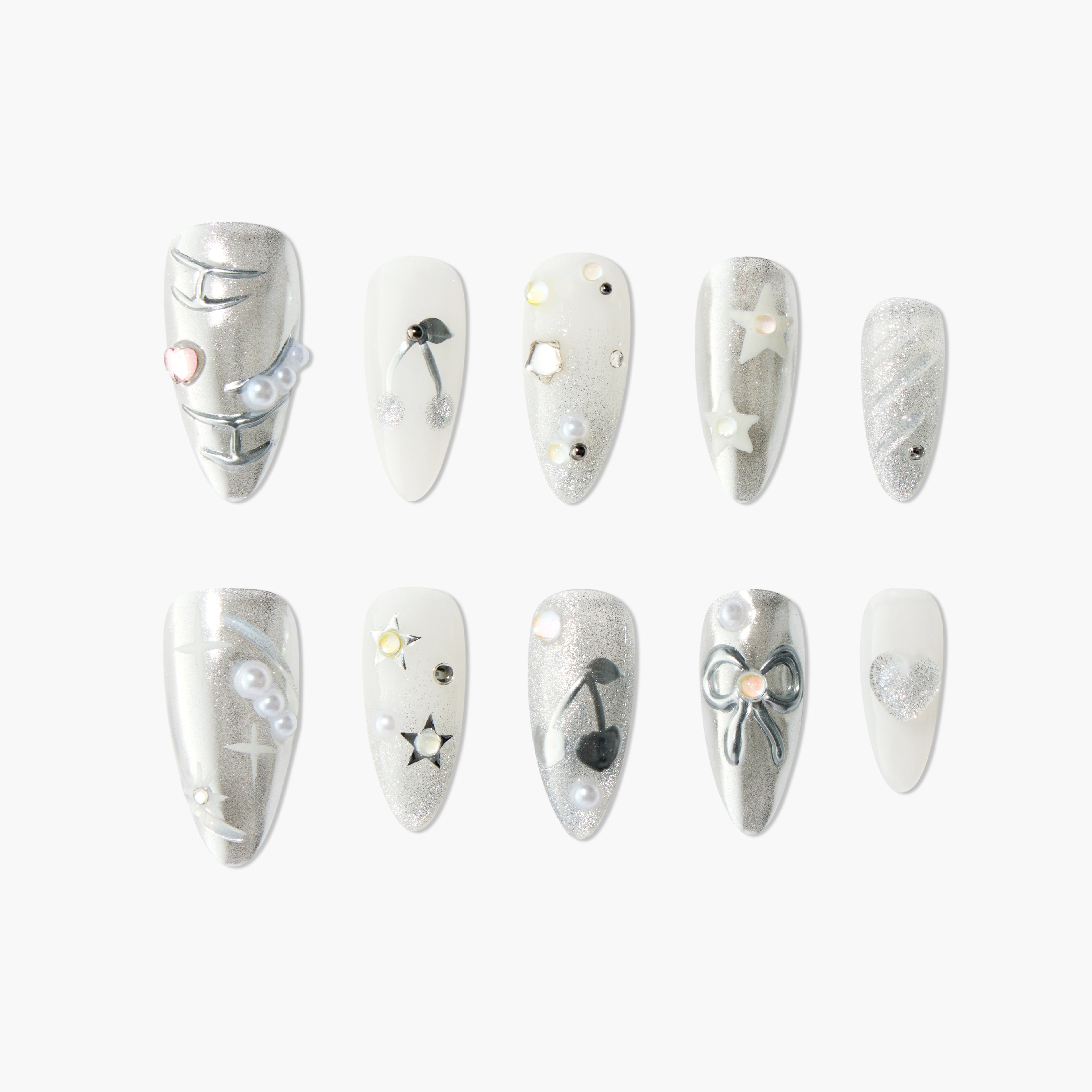 Silver and white press-on nails with glitter, stars, bows, pearls, and heart accents