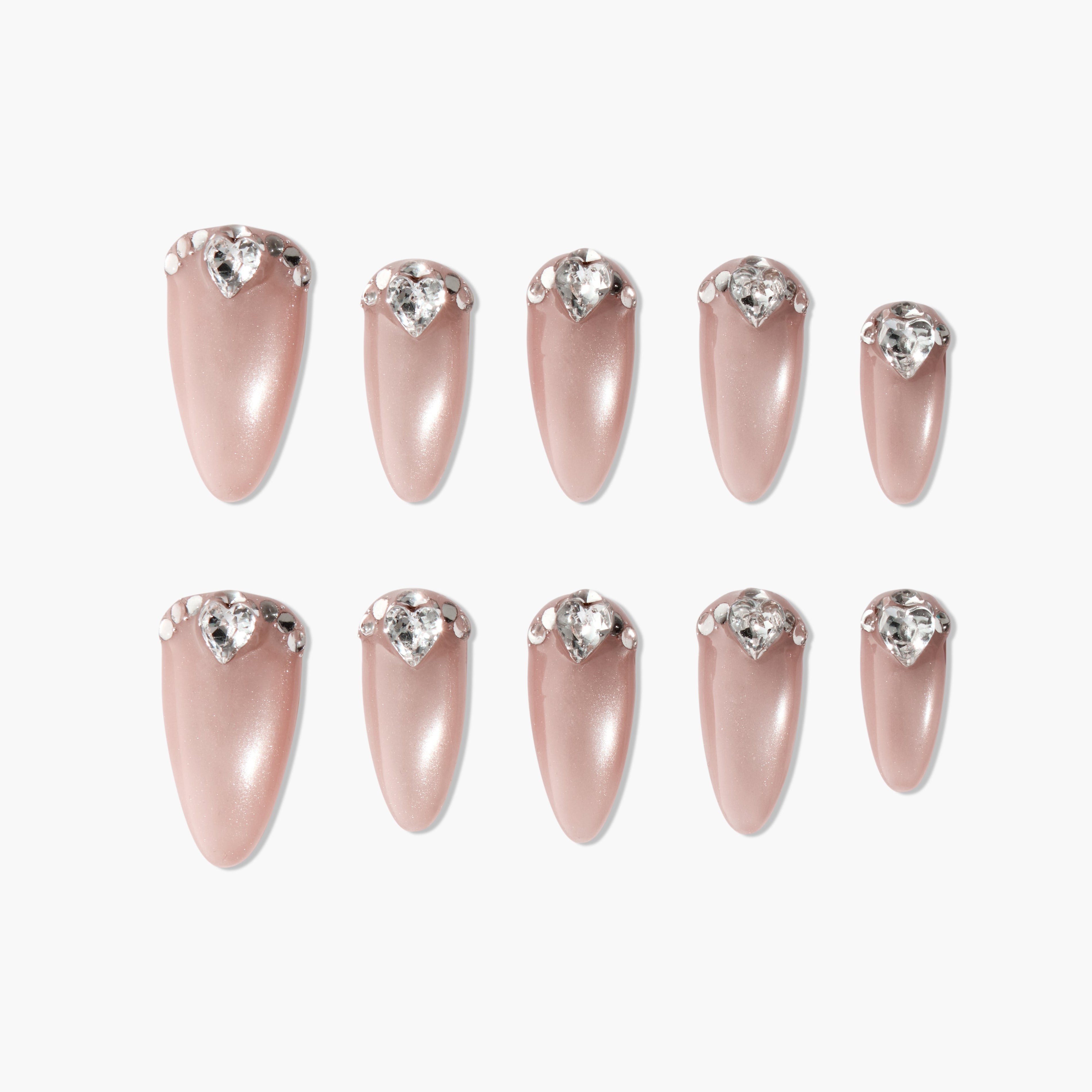 Set of pink almond-shaped press-on nails with heart-shaped rhinestone accents
