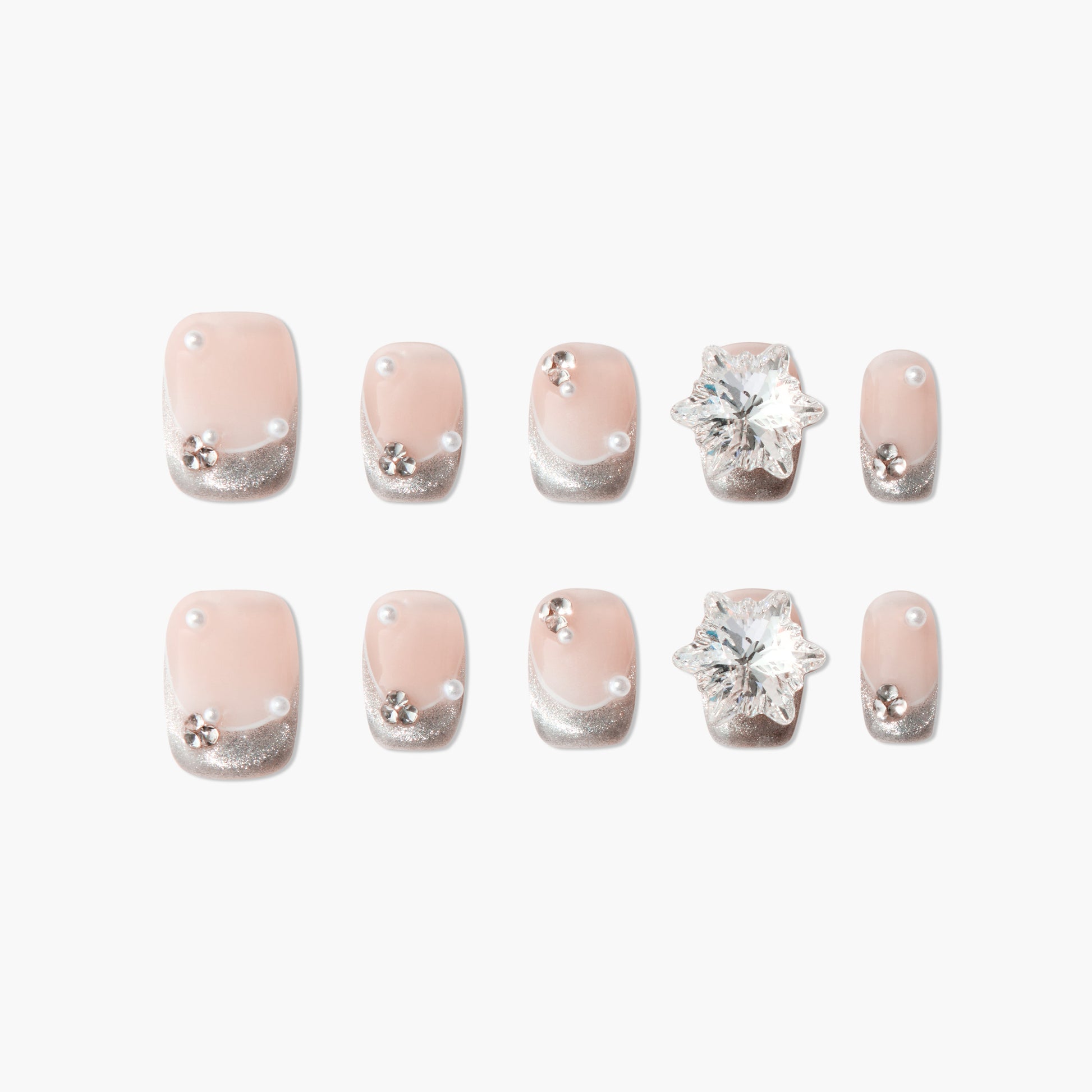 Handmade press-on nails with pink base, silver glitter tips, pearls, and floral rhinestones