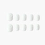 Set of white press-on nails with embossed bow design, displayed on a plain background.