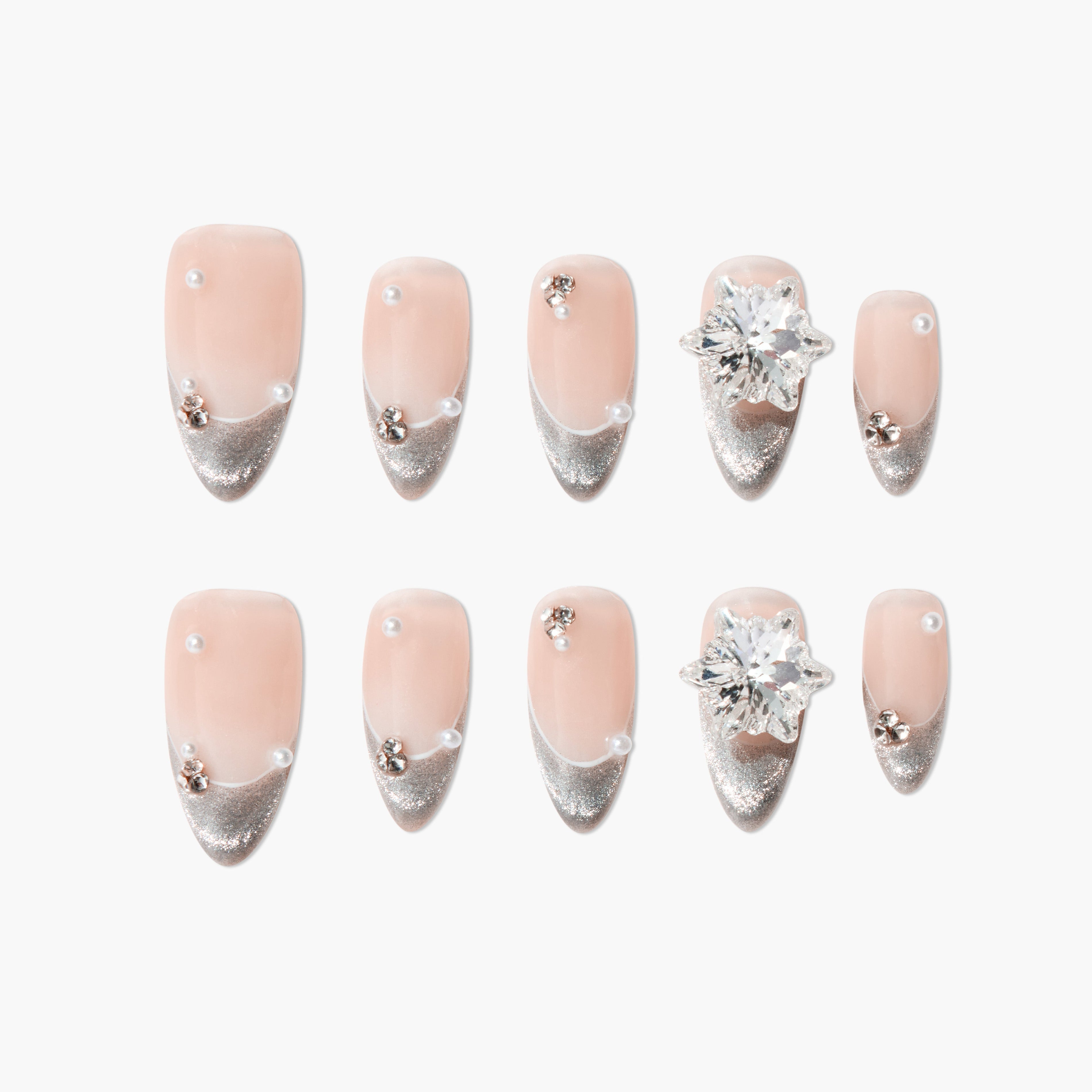 Handmade press-on nails with nude base, silver glitter tips, pearls, and crystal accents