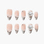 Handmade press-on nails with nude base, silver glitter tips, pearls, and crystal accents