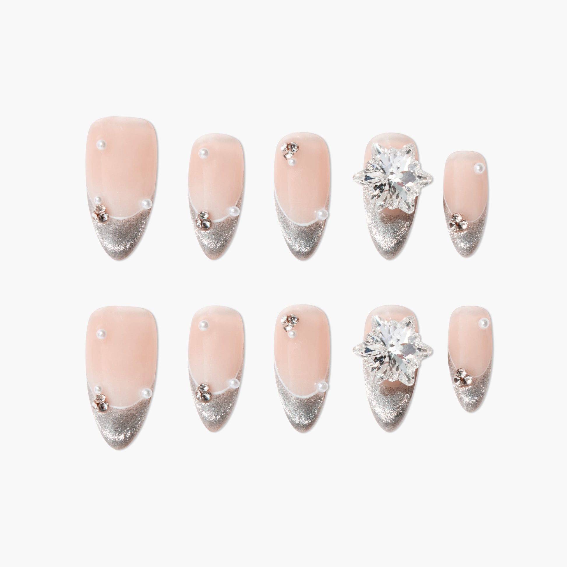 Handmade press-on nails with nude base, silver glitter tips, pearls, and crystal accents