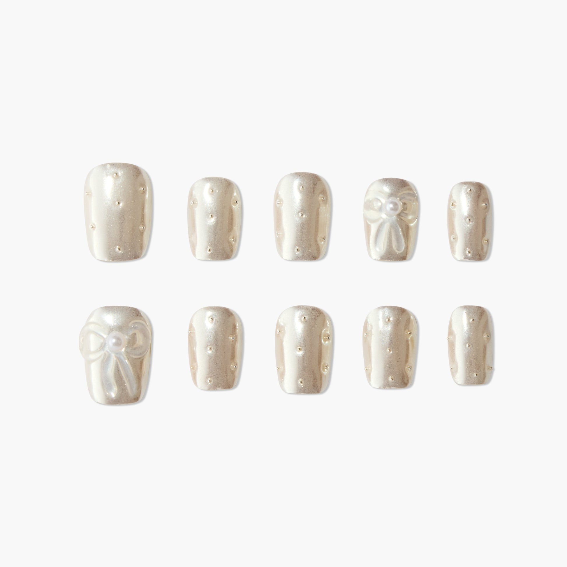 Pearl white press-on nails with 3D bow and delicate pearl accents, elegant nail art set.