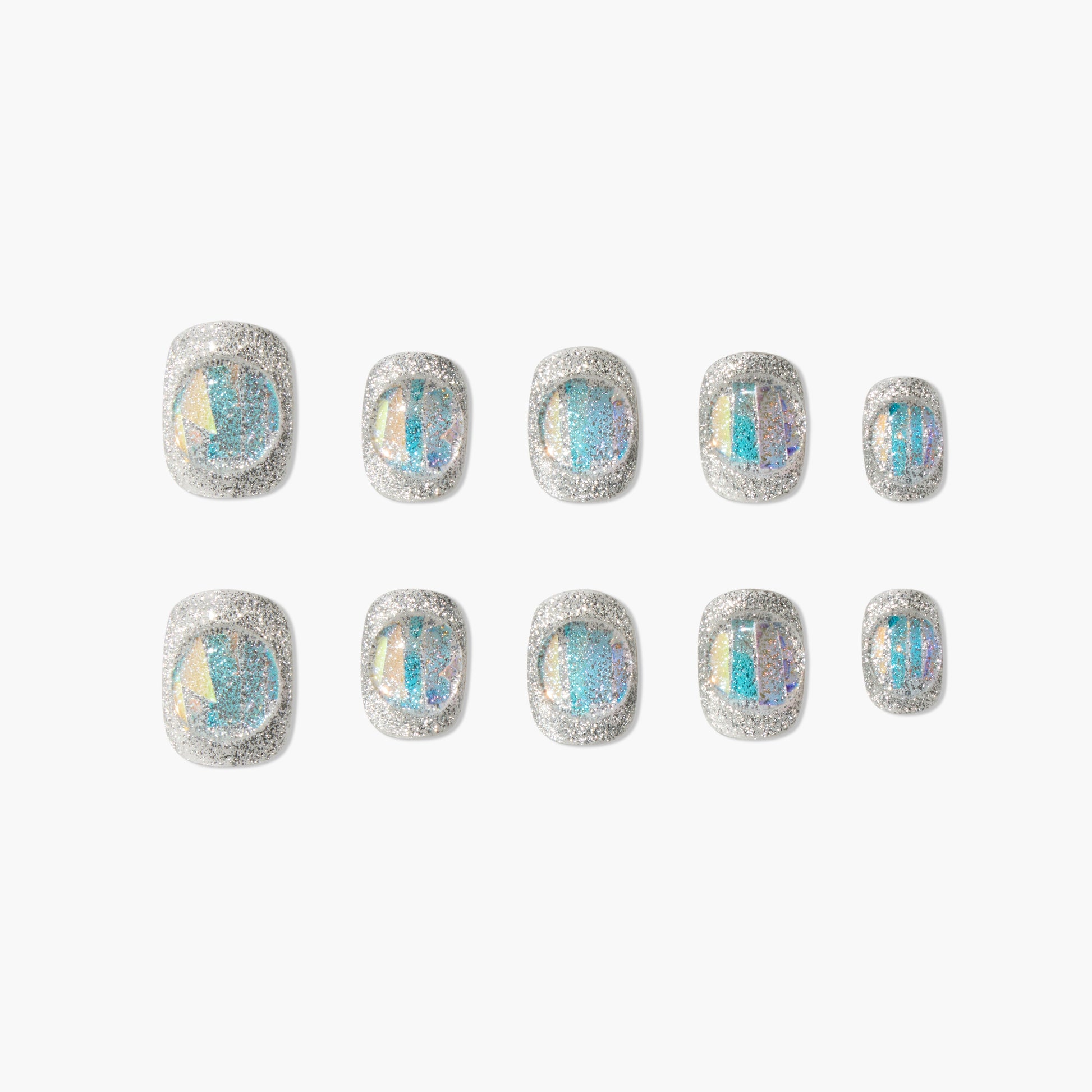 Set of silver glitter press-on nails with iridescent blue accents on a white background