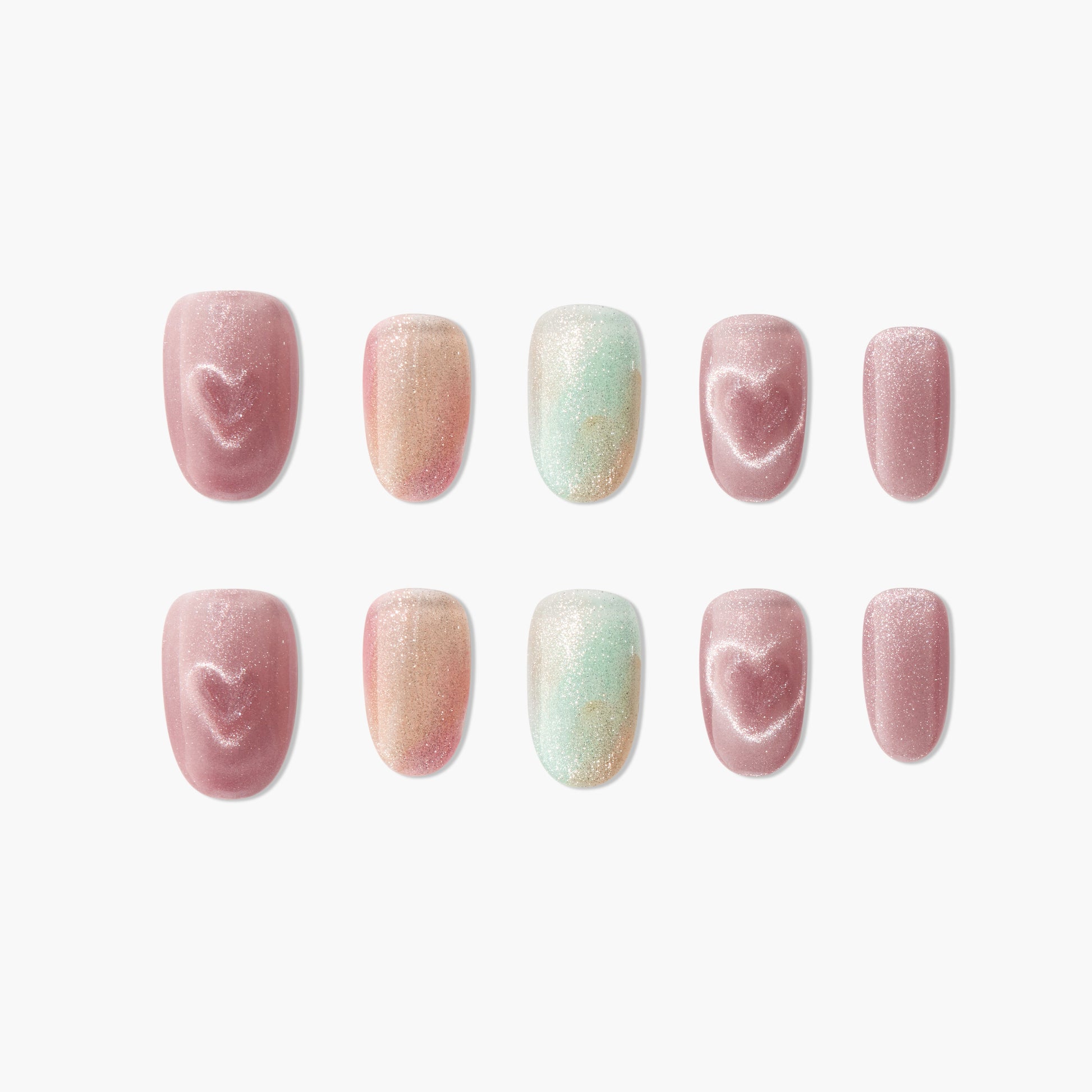 Handmade press-on nails with pink shimmer, heart designs, and pastel gradient accents