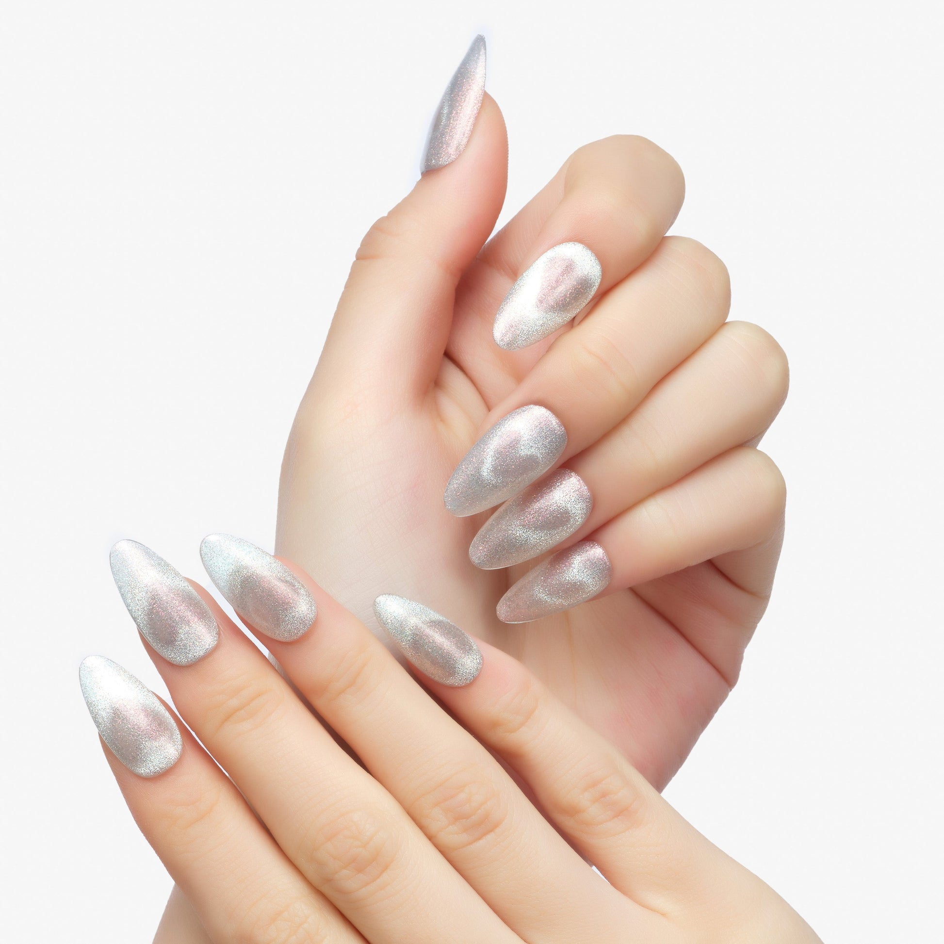 Hand with long almond-shaped silver chrome press-on nails, white background