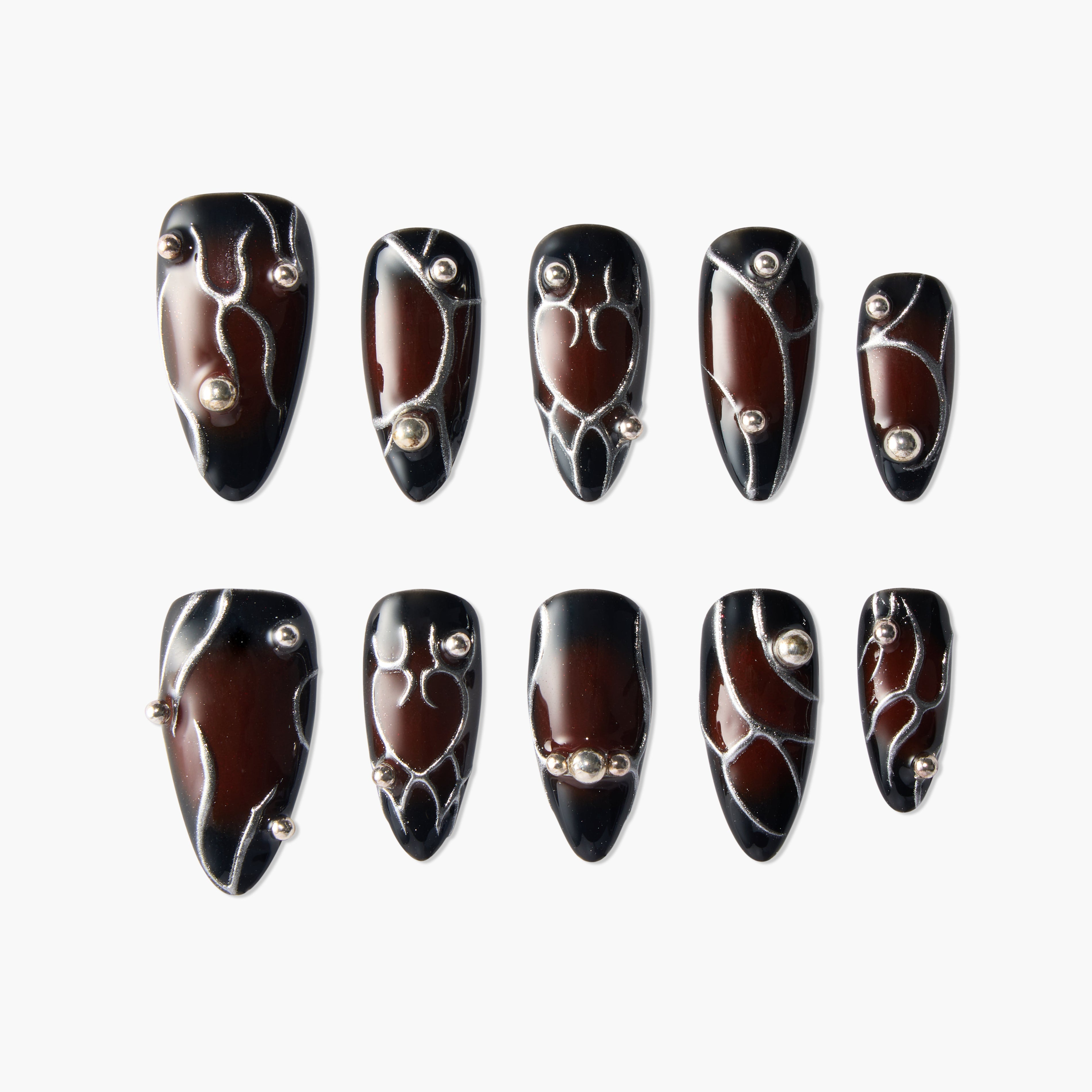 Glossy brown and black press-on nails with silver lines and 3D bead accents, set of ten