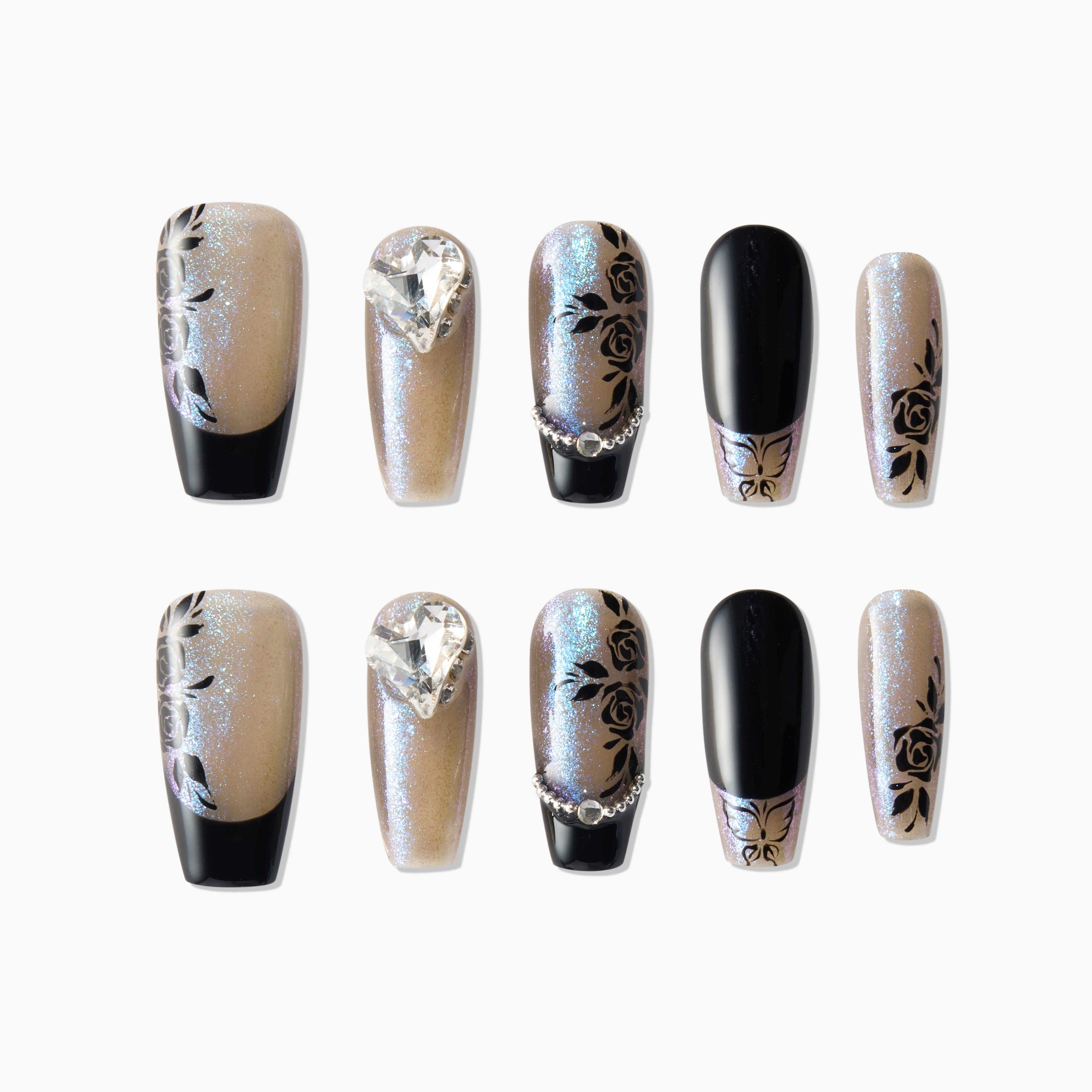 Black and glitter press-on nails with rose designs, rhinestone and chain accents, coffin shape