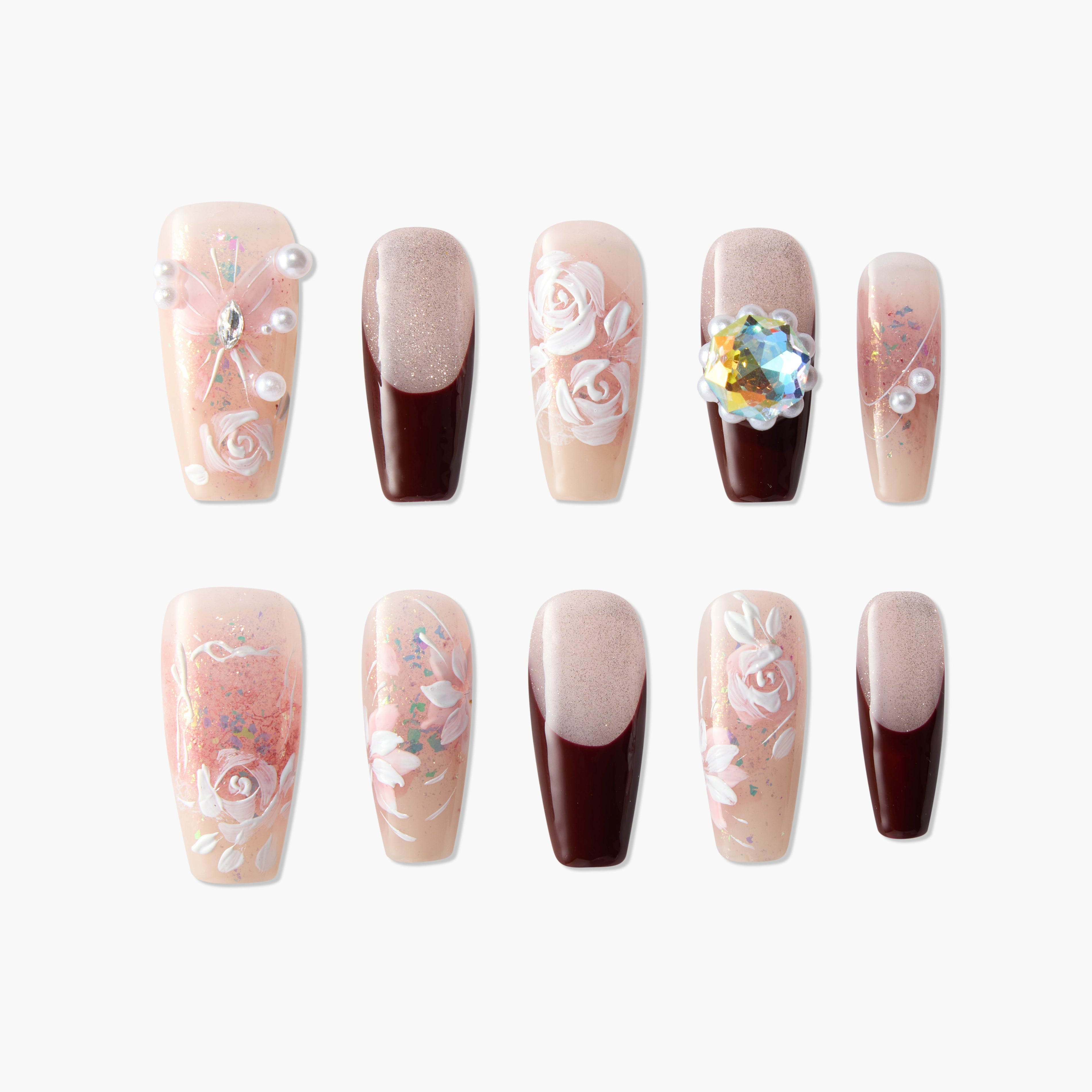 Handmade press-on nails with floral designs, pearls, glitter, and burgundy French tips