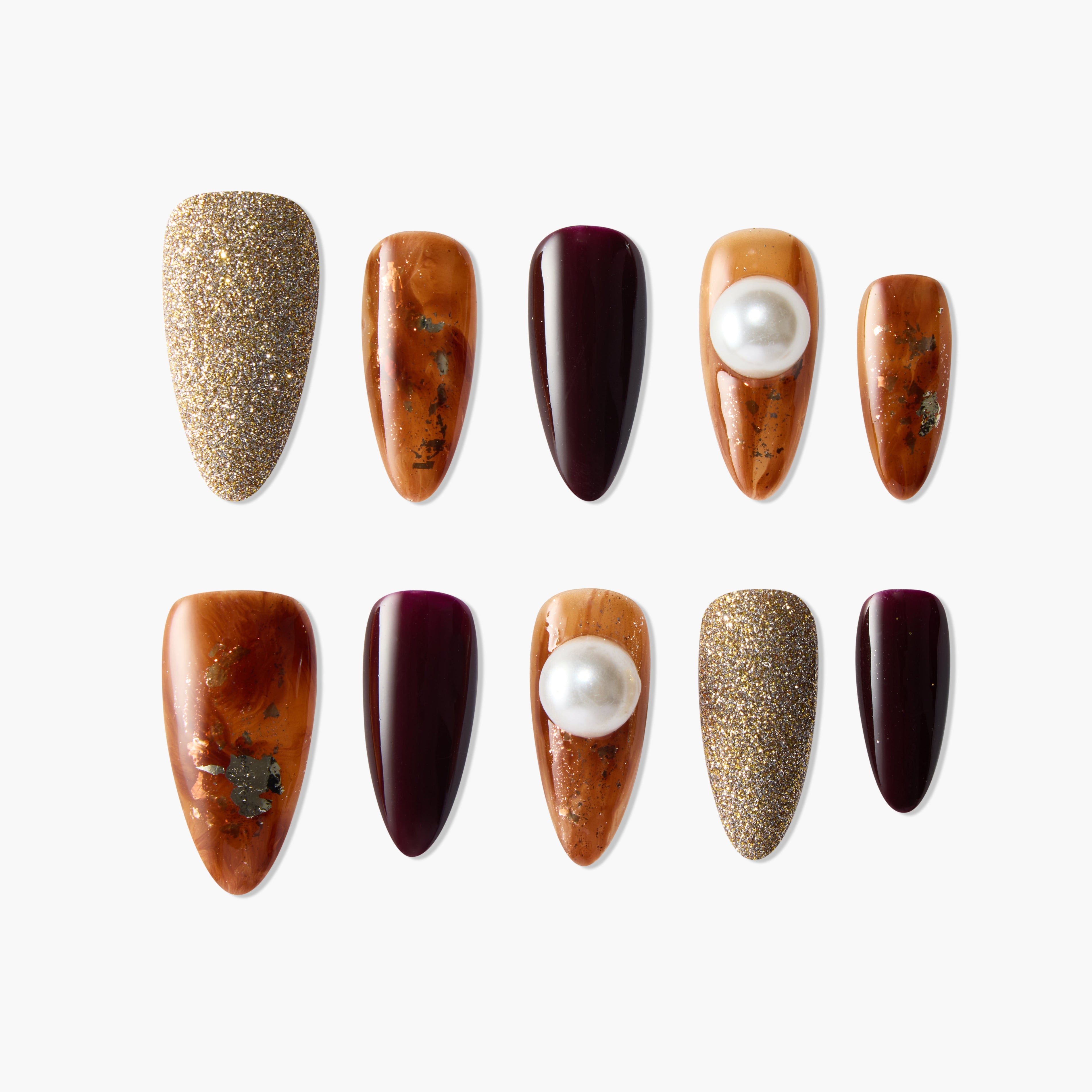 Set of handmade press-on nails with gold glitter, marbled brown, deep burgundy, and pearl accents