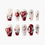 Handmade press-on nails with red and silver gems, glitter, and 3D embellishments