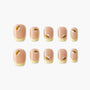 Bee-themed handmade press-on nails with nude and yellow tips, arranged on white background