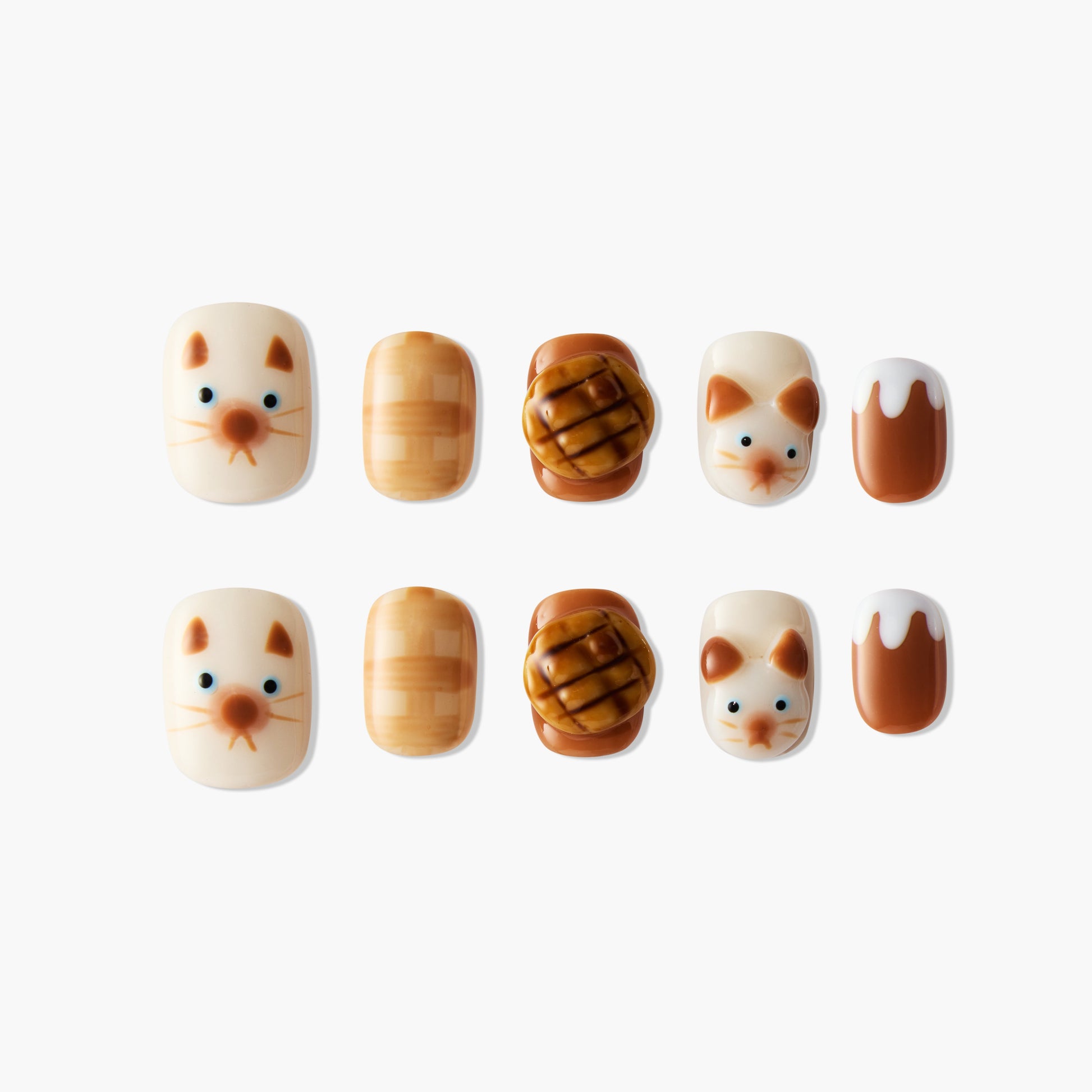 Cute press-on nails with cat faces, brown pastries, and dessert designs on white background