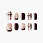 Glossy press-on nails with burgundy and nude plaid design, rhinestone and ribbon accents