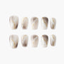 Handmade press-on nails with marble beige and gold accent design, salon-quality finish