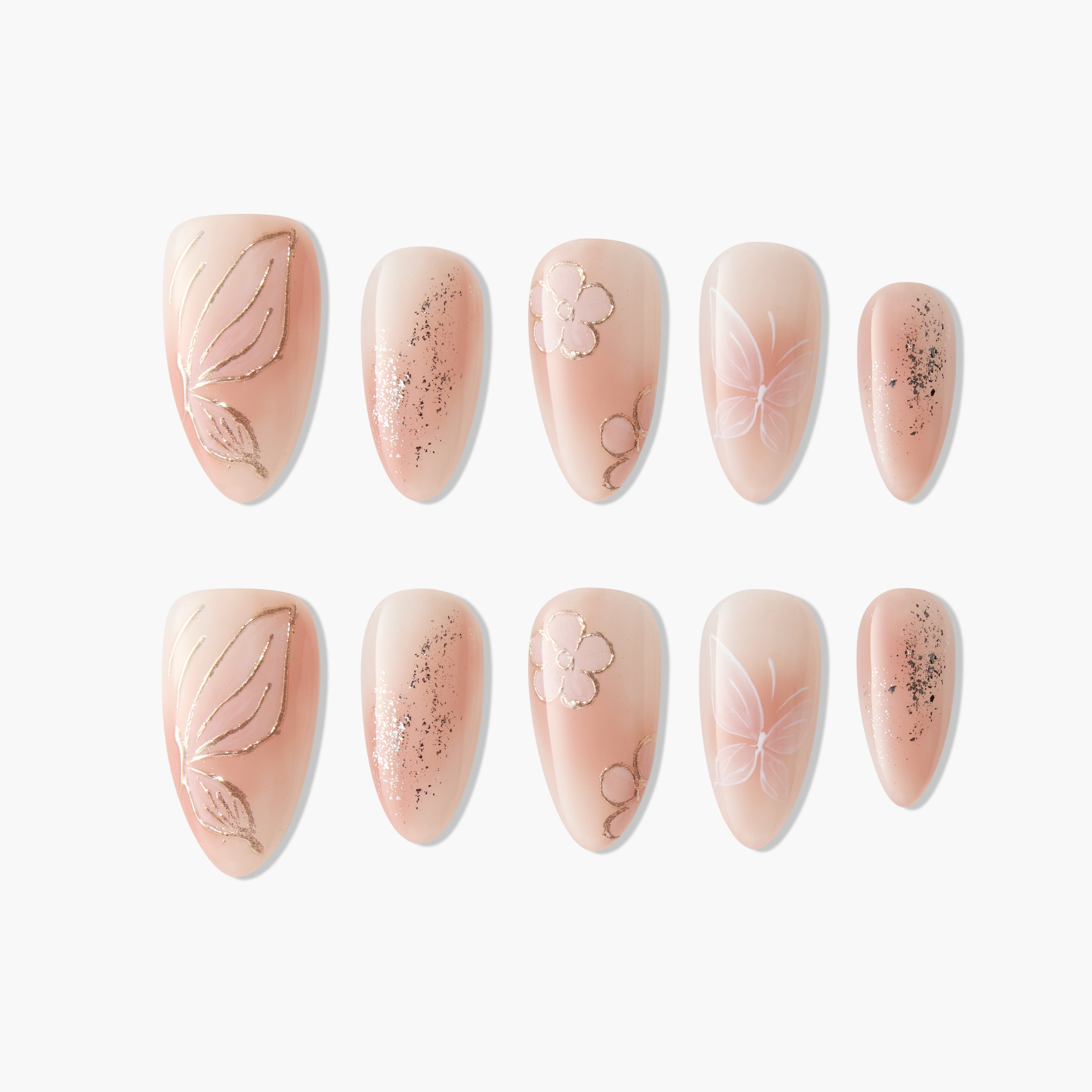Handmade press-on nails with nude base, floral and butterfly designs, and gold glitter accents.